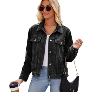 Modern women's slim fit washed black denim jacket styled with sunglasses and bag