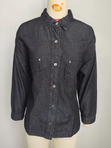 Detailed macro view of a vintage loose casual black denim shirt displayed on a mannequin