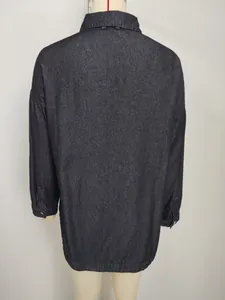 Detailed back view of a minimalist retro oversized dark wash denim shirt on a mannequin