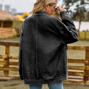 Back view of a classic black vintage loose-fit denim jacket with washed texture