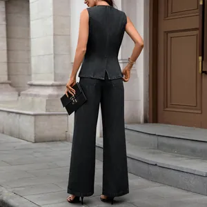 Back view detail showing the elegant washed denim sleeveless vest and wide-leg pants