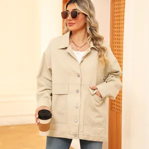 Detailed view of beige vintage loose denim jacket with large front pockets