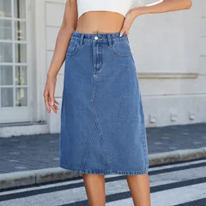 Detail of washed denim midi skirt featuring a high waist and front seam accents