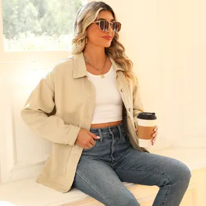 Model wearing a vintage khaki oversized casual corduroy jacket with coffee cup