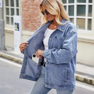 Detailed view of the internal pocket in a vintage washed blue denim jacket for women.