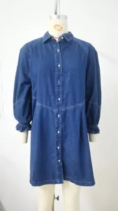 Washed denim long-sleeve dress with button-front and ruffle cuffs on mannequin