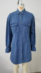 Front view detail of a loose washed blue denim shirt dress on a mannequin
