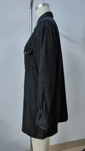 Side view detail of black washed denim dress featuring unique elastic ruffled cuffs
