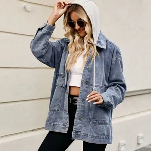 Detail view of women's oversized vintage denim jacket featuring a grey drawstring hood