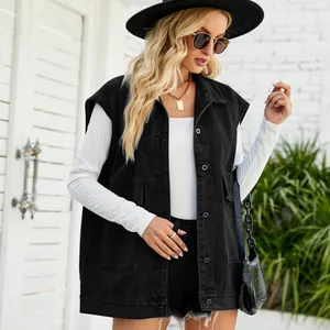 Stylish women's black sleeveless denim vest shown in a fashionable lifestyle outdoor setting