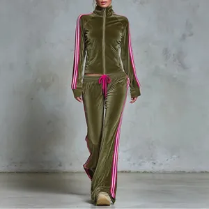 Full view of olive green velvet tracksuit with high-neck zip jacket and wide-leg pants.