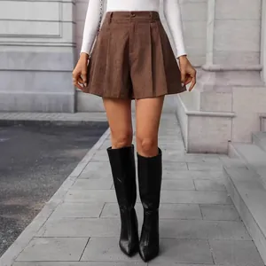 Detailed macro view of brown faux suede high-waisted pleated wide-leg casual shorts