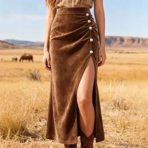 Brown high-waisted suede midi skirt featuring side slit and white pearl buttons.