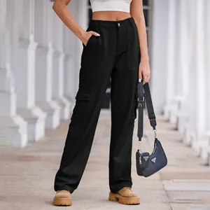 Detail showing black cargo pants fit and style on a model in an outdoor setting