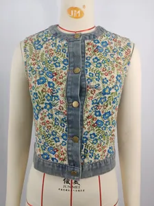 Close-up view of the intricate floral jacquard pattern and denim trim detail