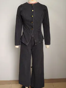 Detailed view of women's washed black denim jacket and wide-leg pants set