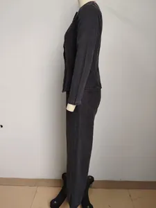 Side view of a washed black denim two-piece set with a long-sleeve jacket and pants.