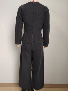 Back view of washed black denim jacket and wide-leg trousers set on a mannequin
