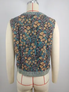 Rear view of a vintage floral jacquard sleeveless vest featuring denim trim details