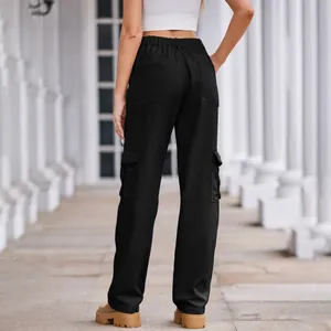 Rear view of women's black cargo pants with elastic waist and side flap pockets detail