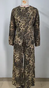 Stylish two-piece leopard print denim jacket and wide-leg trousers set for casual wear.