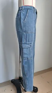 Side view detail of washed light blue denim cargo pants with half-elastic waist