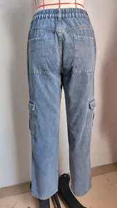 Detailed back view of women's washed denim cargo pants with semi-elastic waist