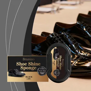 Close-up of Brunizo black shoe shine sponge with polished leather shoes in background