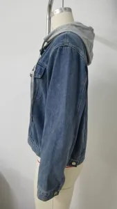 Side view of slim fit washed denim jacket with grey jersey hood for women