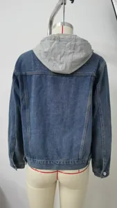Rear view of a washed blue denim jacket featuring a grey hood and slim fit detail