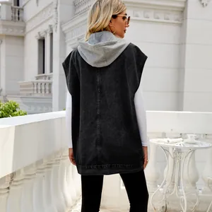 Back view of women's black denim sleeveless vest with grey hoodie detail detail.