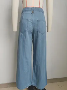 Back view of stylish high waisted light blue wide leg denim jeans on mannequin