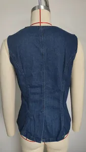 Back view of a fashionable washed blue denim sleeveless vest top displayed on a mannequin