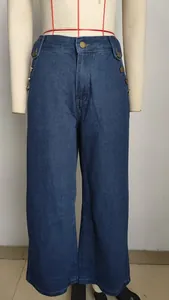 High-waisted wide-leg denim jeans with decorative side buttons and dark blue wash