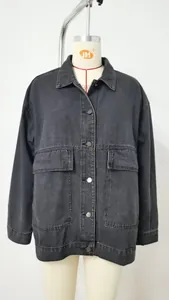Front view of black loose-fit denim jacket with button closure and large chest pockets