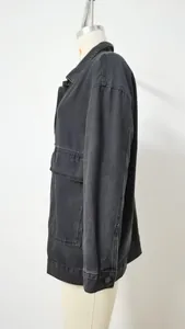 Detailed side view of a vintage black loose-fit denim jacket displayed on a mannequin