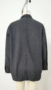Detailed back view of a vintage black loose denim jacket on a mannequin display