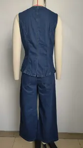 Rear view of elegant dark blue denim sleeveless vest and wide-leg trousers set