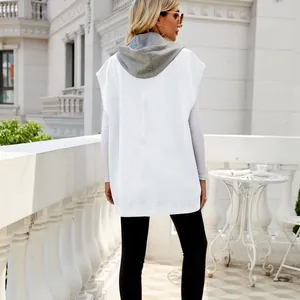 Back view of a stylish white denim hooded vest for women in an outdoor setting