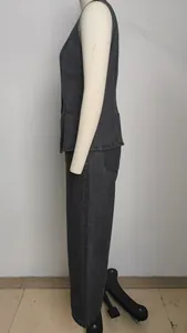 Detailed side view of a stylish washed dark gray denim vest and matching pants set