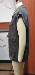 Detailed side view of a stylish black washed denim vest for women on a mannequin
