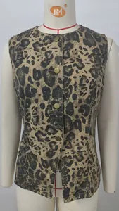 Detailed view of women's leopard print denim vest featuring vintage metal buttons