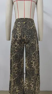 Back view of leopard print wide-leg denim pants showing pocket and metal button details