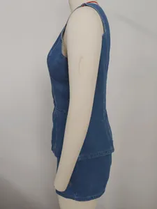 Side view detail of a blue washed denim sleeveless top and shorts set on mannequin.