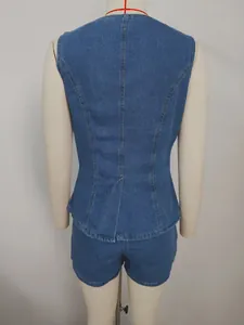 Back view of a washed blue denim sleeveless vest and matching shorts set on a mannequin