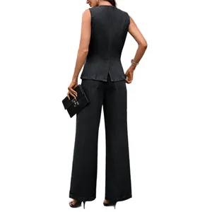 Chic dark wash denim two-piece set featuring a sleeveless vest and stylish wide-leg jeans.