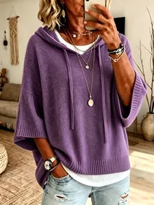 Close-up detail of women's purple hooded knit sweater featuring adjustable drawstrings