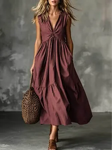 Elegant sleeveless V-neck tiered maxi dress with twist bust detail in dark mauve