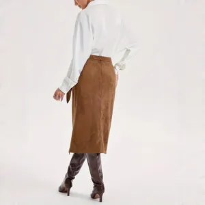 Elegant brown suede midi skirt for women with side tie-knot detail and white blouse