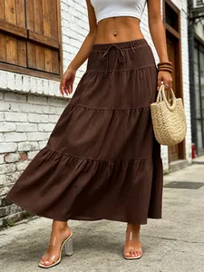 Elegant brown tiered maxi skirt with drawstring waist and textured fabric for summer casual wear